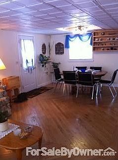Dining Room, open floor plan
						:
						Custom hardwood floors, drop ceiling. Morning light. Side door entrance.
