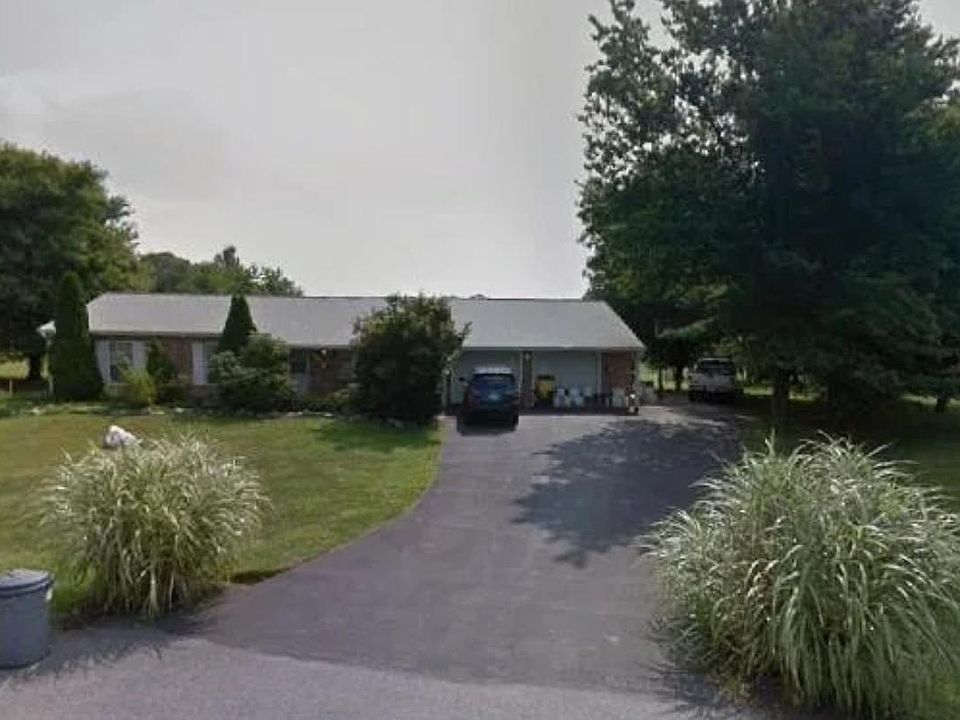 Property from the Cul-de-sack. Plenty of parking, bring your outdoor toys, boats, RVs, or extra vehicles. Basketball hoop on drive near tree line.