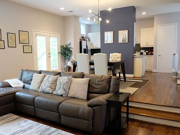 Open dining room with 2 steps that create a nice separation