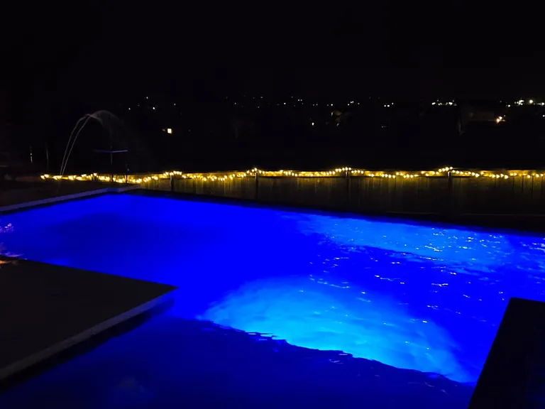 City lights below. Stars above. Spa all around.