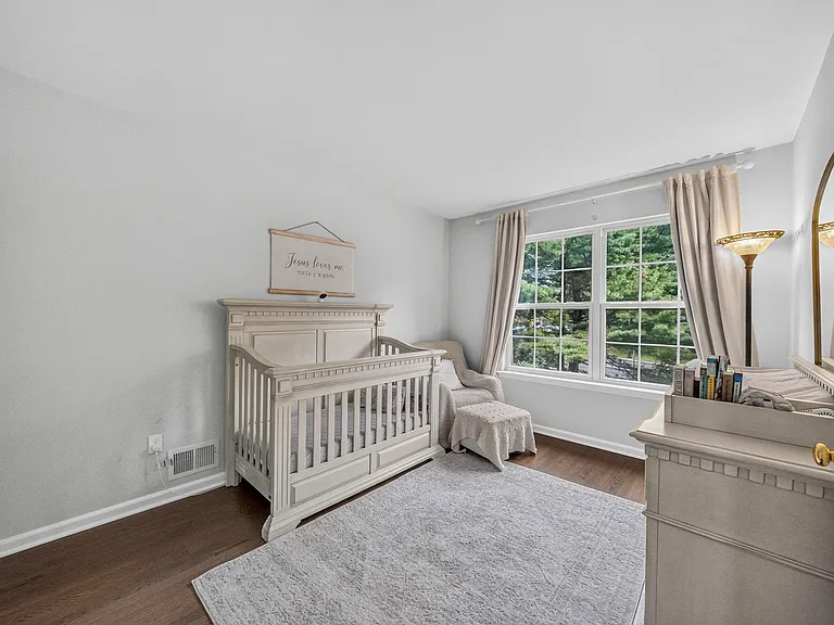 Bright Bedroom with Large Windows and Walk-In Closet