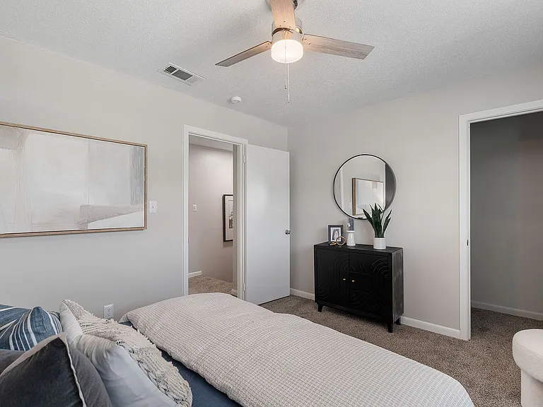 Cozy bedroom with carpet & ceiling fan