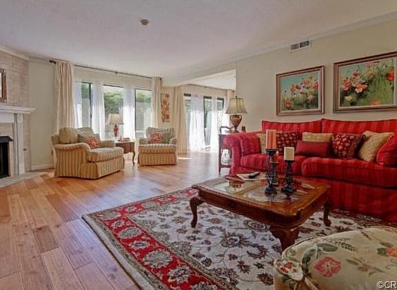 Living Area with Fireplace and Hardwood Flooring