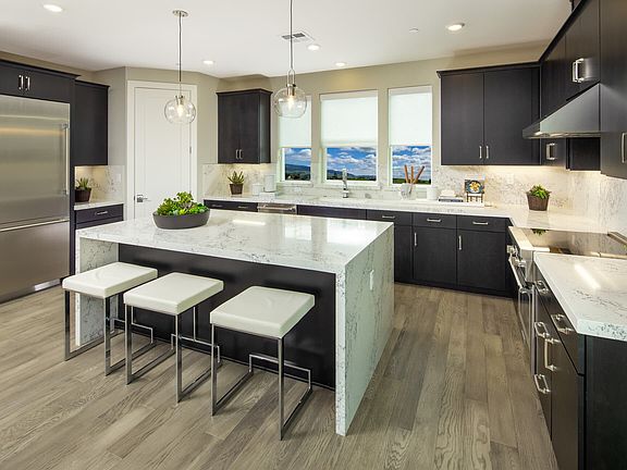 This modern kitchen is a sleek and functional culinary space that combines cutting-edge design with