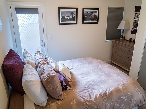 Downstairs bedroom with queen bed