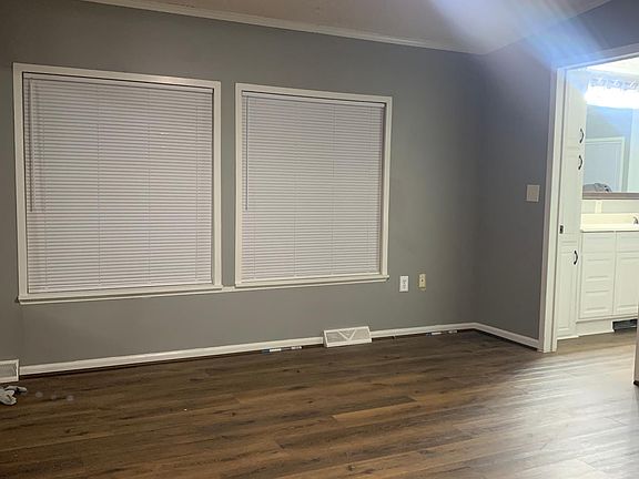 Master bedroom with a joint parent retreat/office/nursery/man cave