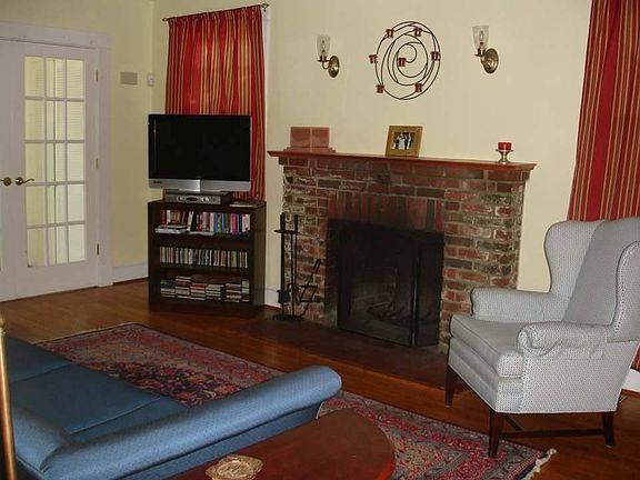 living room with woodburning fireplace