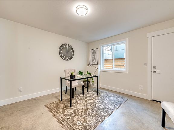Interior photos of Model Home 10016. First floor bedroom past the garage works great as a home office for today's work from home lifestyle or as a workout / hobby room. Room has polished concrete flooring and its own separate side door for easy access.