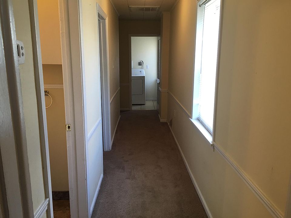 Hallway where bathroom, bedroom 2, bedroom 3 and laundry are located.