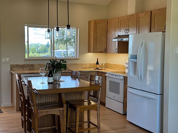 All new appliances and cabinets with center table, pendant lights, and lots of natural light. Kitchen access to the back deck.