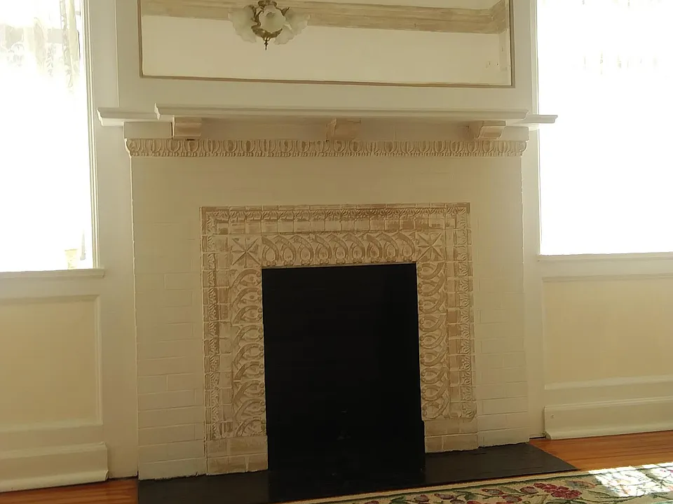 Century architecture with original fireplace in spacious entry foyer