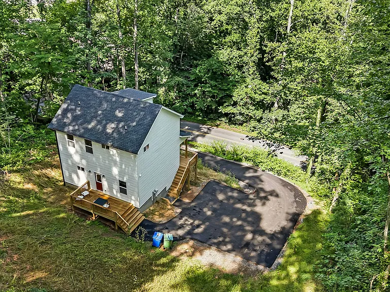 Sloped lot, still minimal area for gardening, note angled uphill driveway
