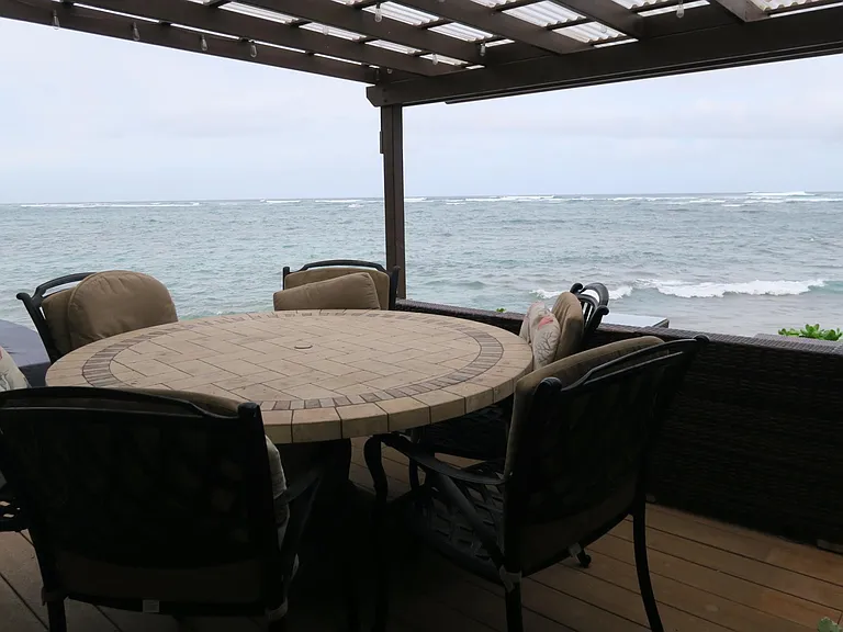 Porch you enjoy as you watch the sea roll in,