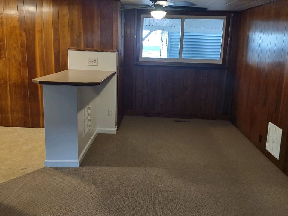 Island separates kitchen from dining area.