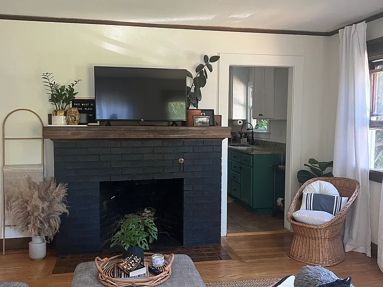 Spacious living room with all of the windows you can imagine, a ton of natural light through the morning and day.