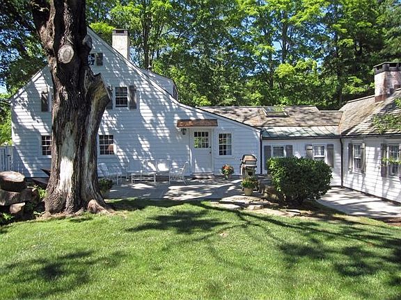 Stone patios with serene pool views...