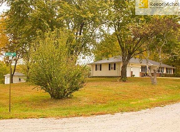 Home is on corner lot with 2.1 acres of land falling away from the home.