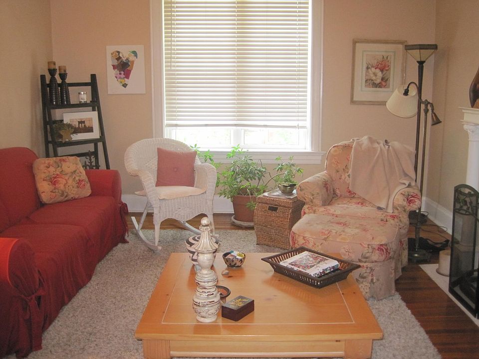 Spacious, sun filled living room with hardwoods
