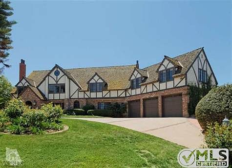 Beautiful circular driveway on this custom Tudor home!