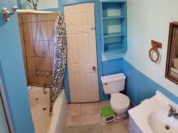 Bathroom (door is full sized, distorted due to used of panoramic mode to visualize more of the room)