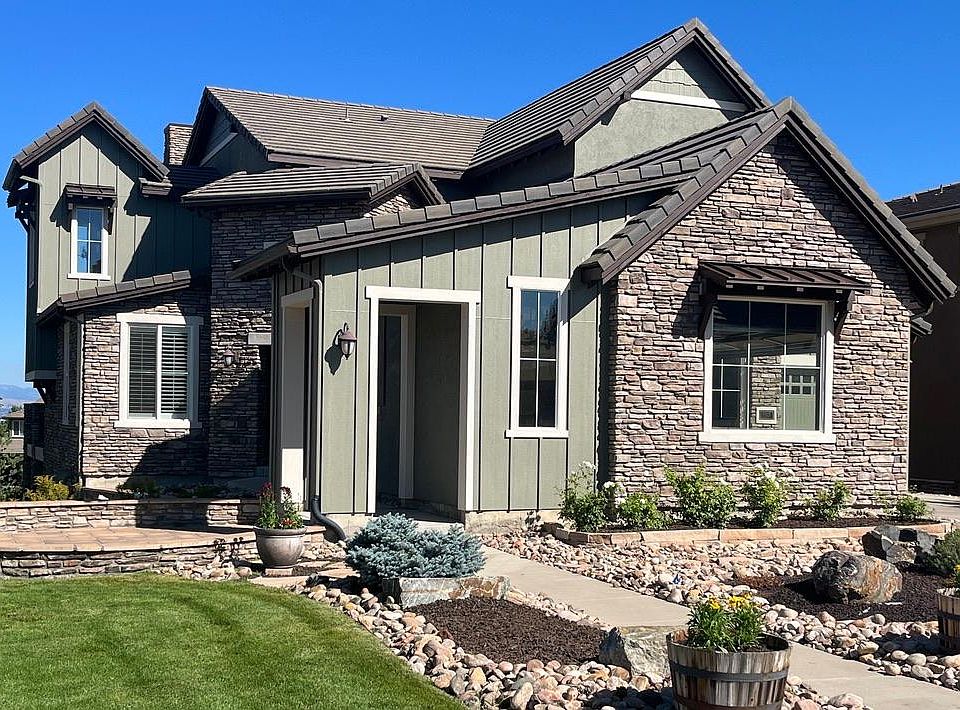 Front of home faces cul-de-sac with large green belt and open space
