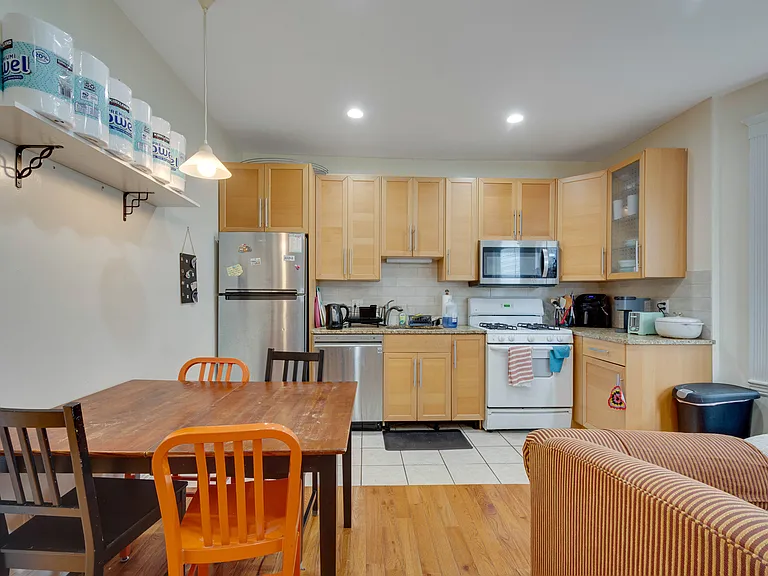 Kitchen comes with refrigerator, dishwasher, microwave, and stovetop.