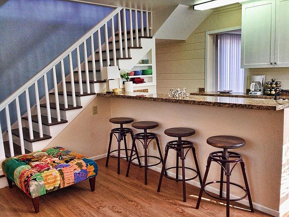 Open floor plan with granite counter between the living room
