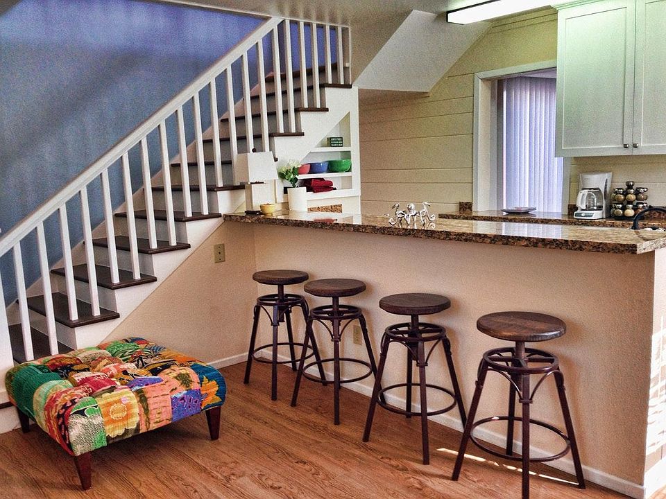 Open floor plan with granite counter between the living room