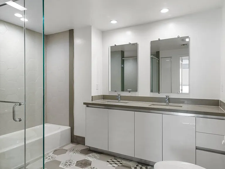 Bathroom with Double-Sink Vanity, Bathtub, and Large Walk-In Shower