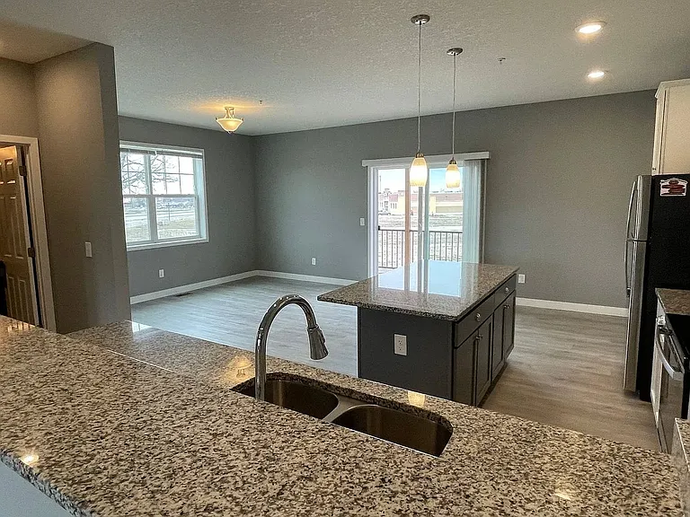 Embrace modern living at LS Capital Group with this spacious, beautifully designed kitchen and living area. Featuring sleek finishes and abundant natural light, itAaas perfect for both relaxation and entertaining. Schedule your tour today!