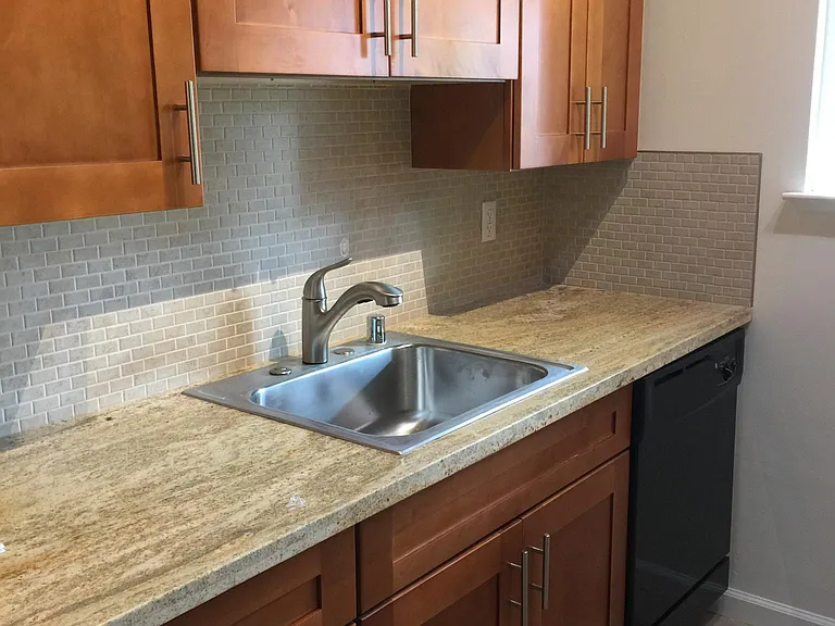 New granite counter tops, custom tile backsplash, new stainl