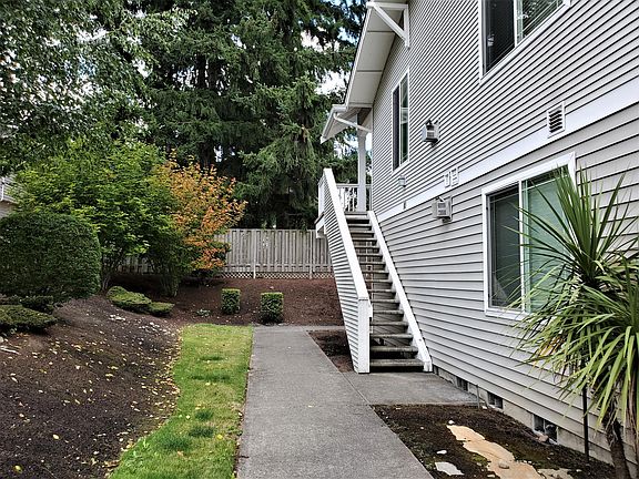 Pristine Landscaping Leads to Private Stairwell