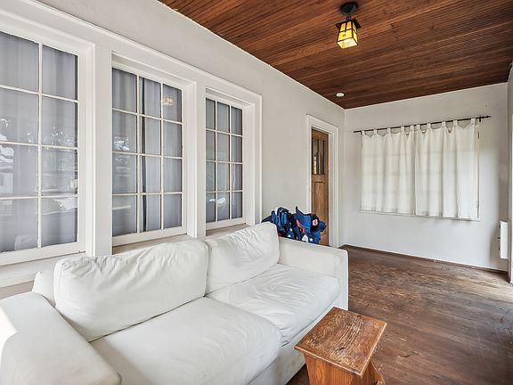 Private Entry, Private Screen Porch with wood floors and wood beadboard ceiling.