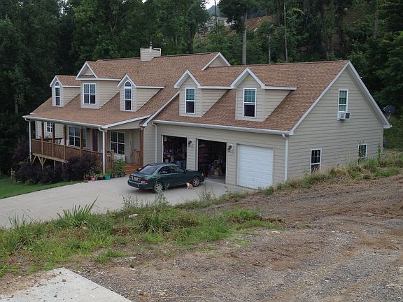 Side view of house with garage view.