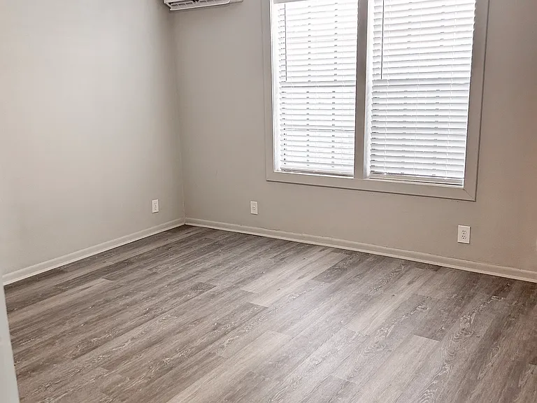 Bedroom entryway - Newly renovated floors, fresh paint and new mini split system. Remote control ceiling fans and mini split.