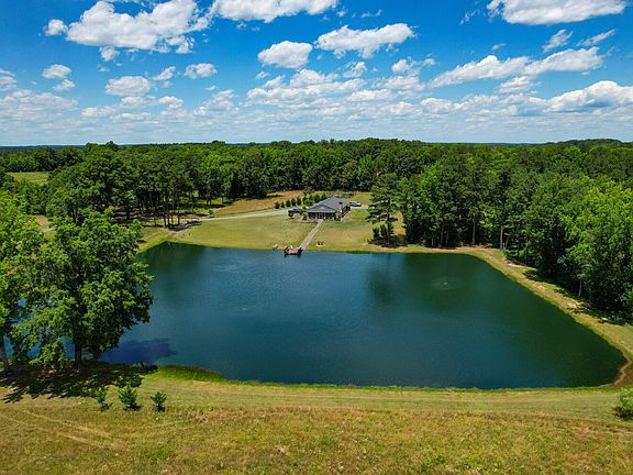 The largest of the two ponds. Two acres. Completely rehabbed in 2017. New dam, fish structures, three aerators, fishing/swimming dock and professionally stocked.