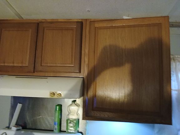 upper cabinets above stove