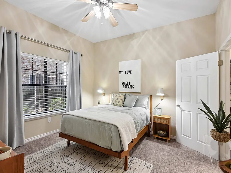 Bedrooms with 9-foot ceilings, oversized windows, and ceiling fans.