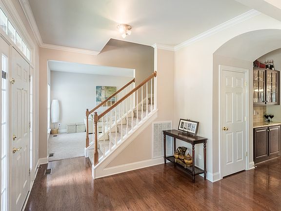 Entry Foyer opens to Formal Dining & Living areas on eithe