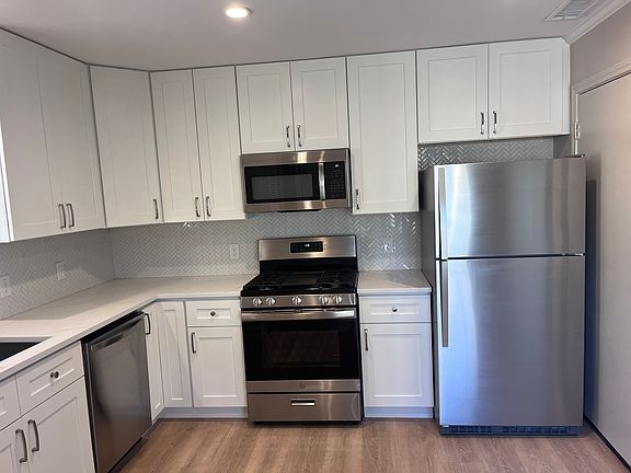 New cabinets, refrigerator with ice maker included