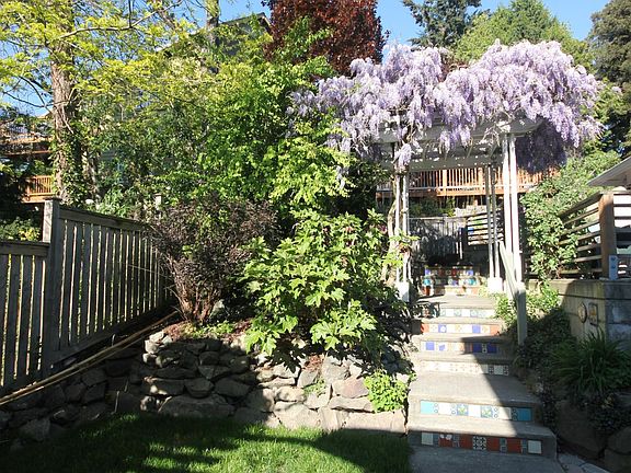 Backyard, steps to alley and garage