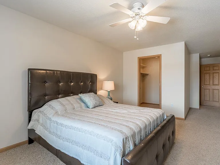 A bright and airy bedroom provides the perfect space to unwind.