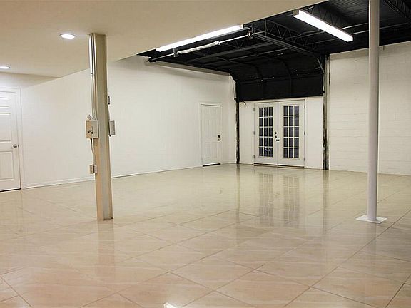 Garage door converted to double doors, very industrial, modern feel.