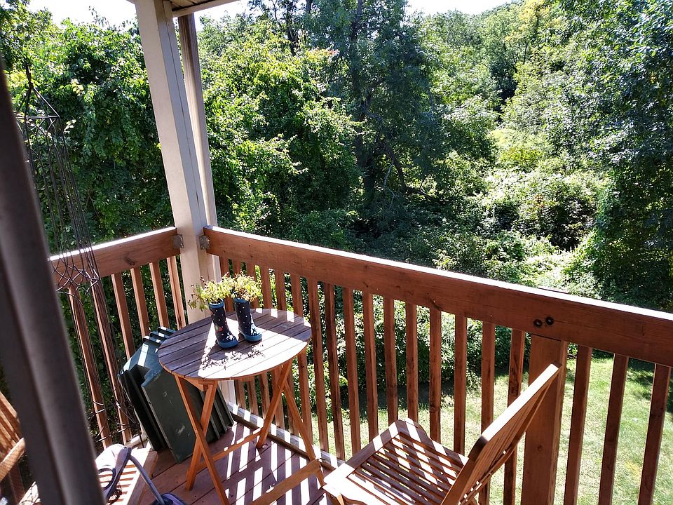 Private balcony with roof and porch light.