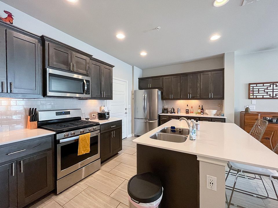 Kitchen with gas stove and stainless steel appliances included. Quartz countertops and lots of cabinet space.