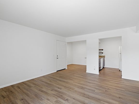 Living room looking in toward dining room and kitchen