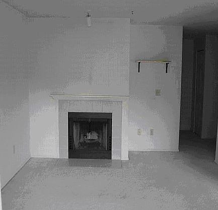 Living room with fireplace and spot lights