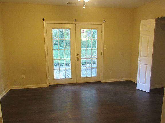Master bedroom has double doors leading to patio.