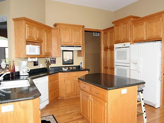 Enjoy the space in this beautiful kitchen which boasts 11 foot ceilings.