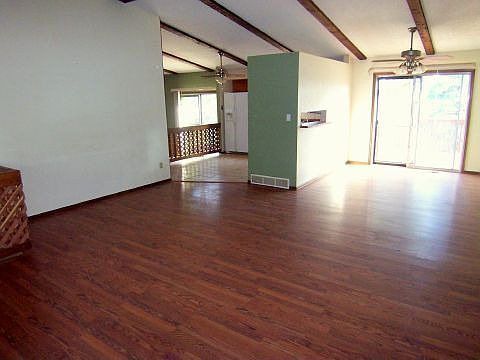 Bright Open Living Room w/ Wood Floors & Vaulted Ceiling